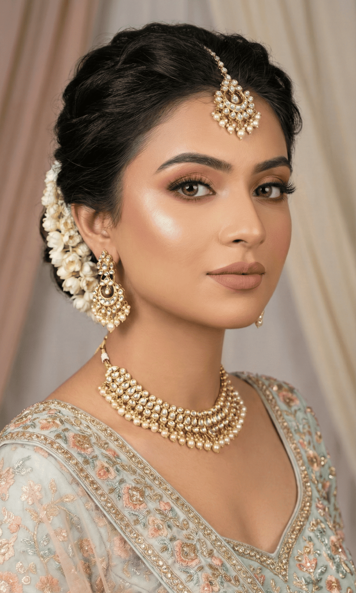 HD engagement makeup for Varanasi bride featuring flawless skin finish and elegant jewelry look